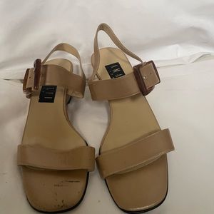 Never worn. Scuffs due to storage and moving.